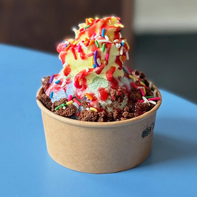 Big Feeling sundae with rainbow sprinkles and berry jam sauce